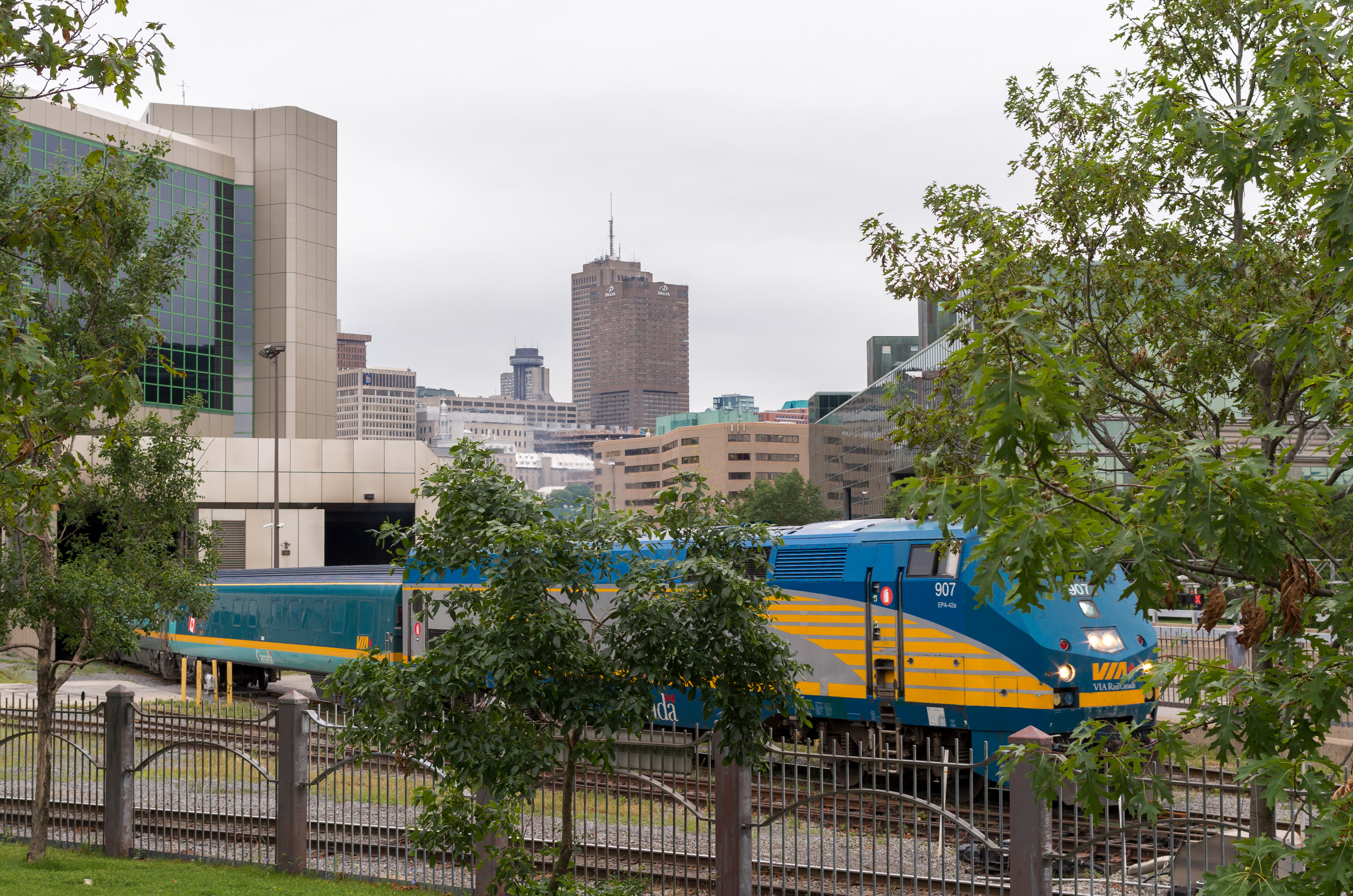 VIA Rail Corridor train at the Quebec City train station with buildings behind