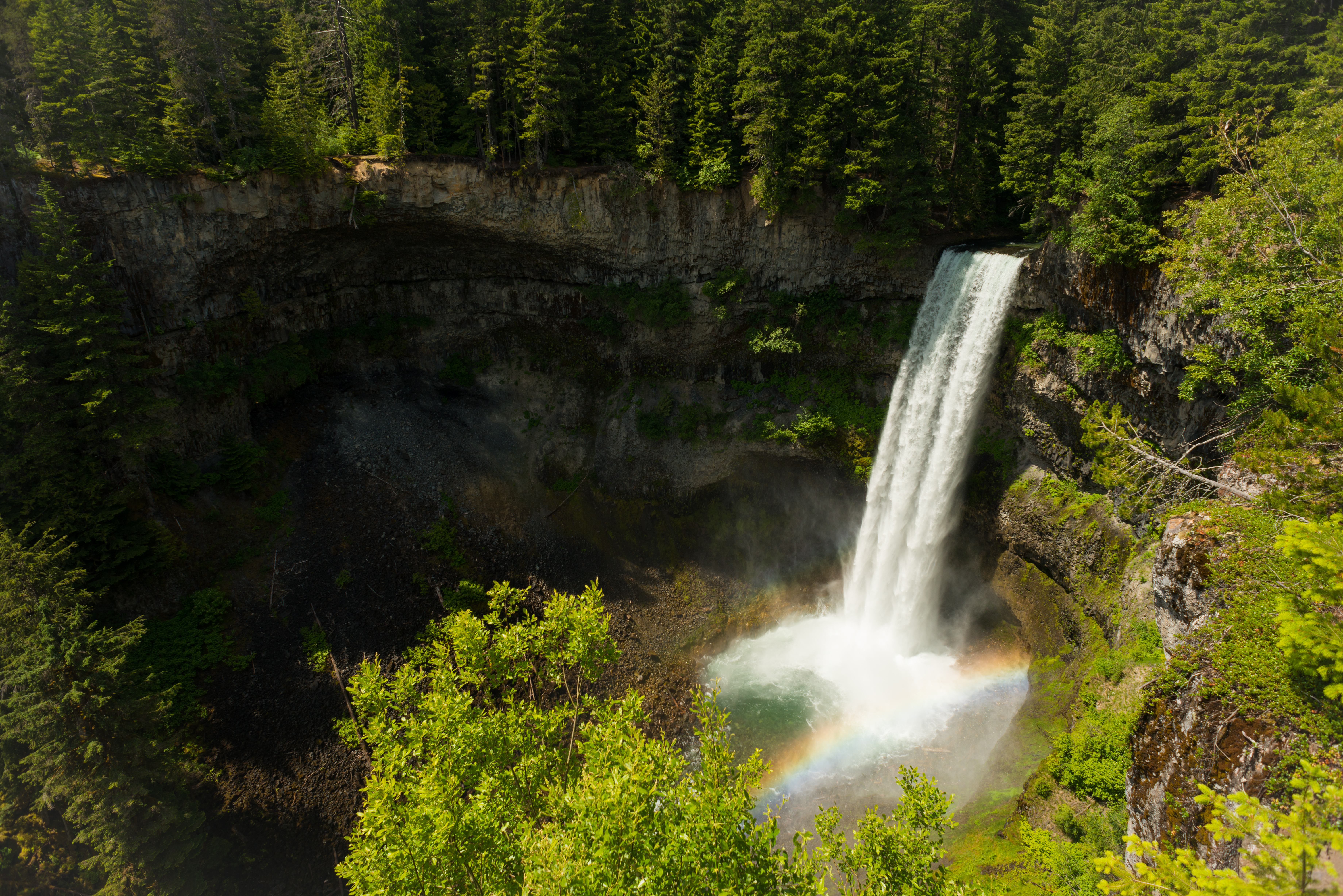 A waterfall surrounded by forest in Whistler 