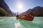 Group of adults paddling in Lake Louise