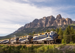 Rocky Mountaineer train passing by Castle Mountain near Banff 