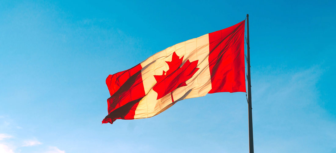 Canadian flag flying in the sky