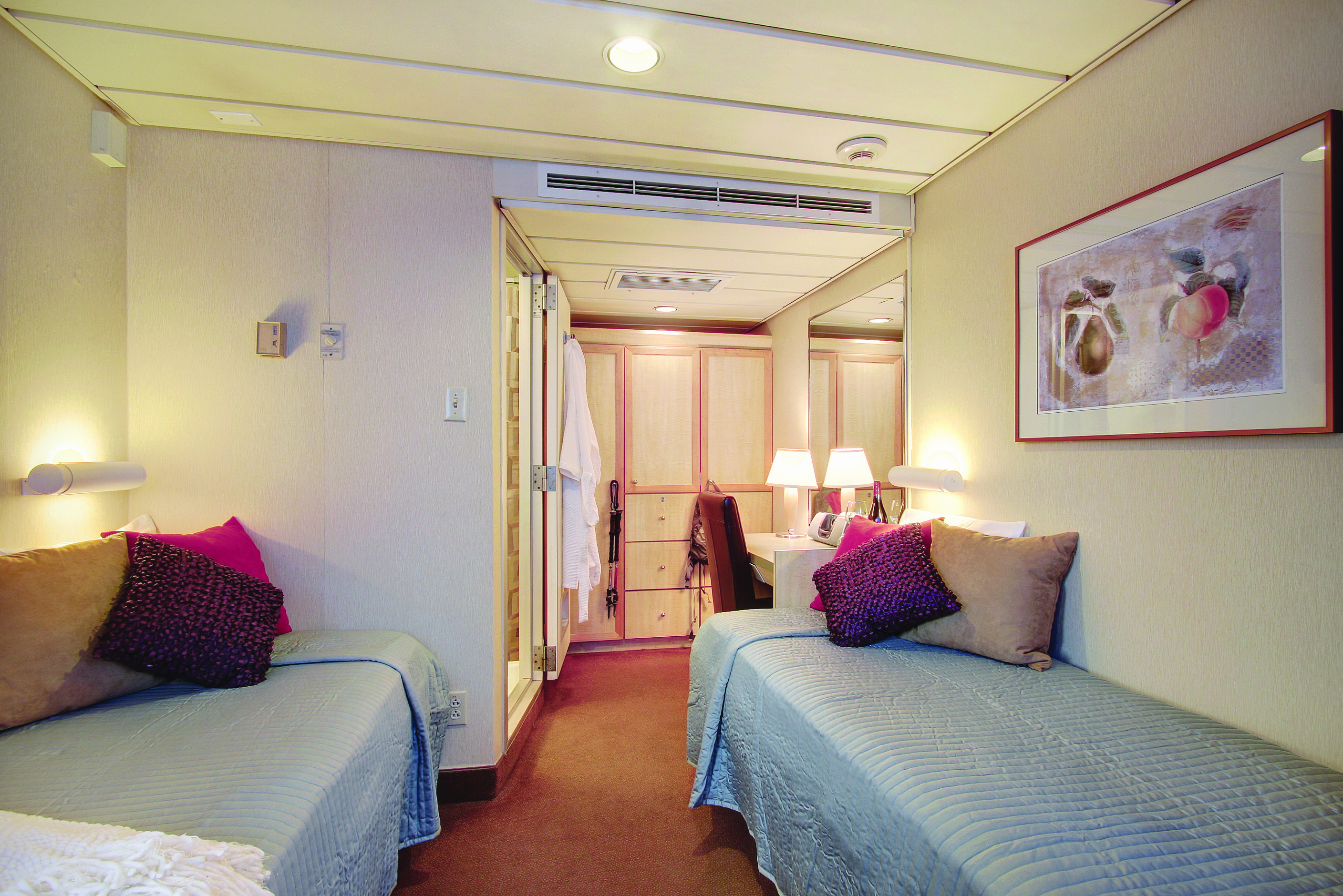 Expedition style cabin aboard the Safari Endeavour, bedding and cupboard