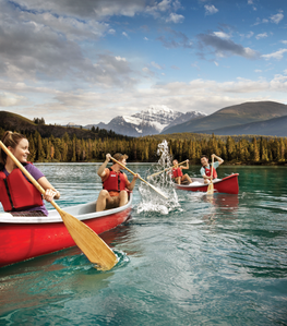 Friends paddling in Lake in Jasper, Alberta