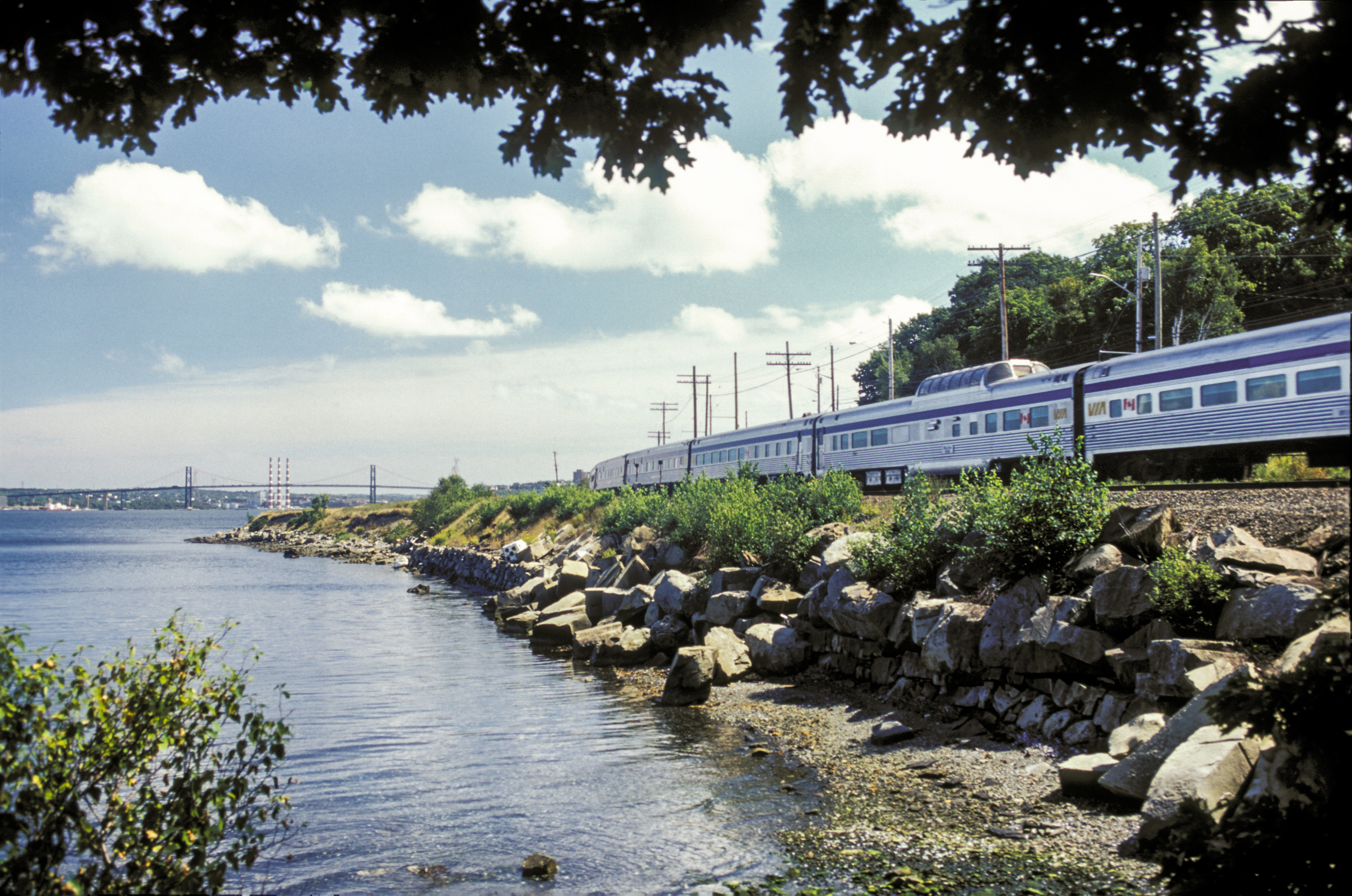 VIA Rail train traveling along the coast in the Canadian maritimes.