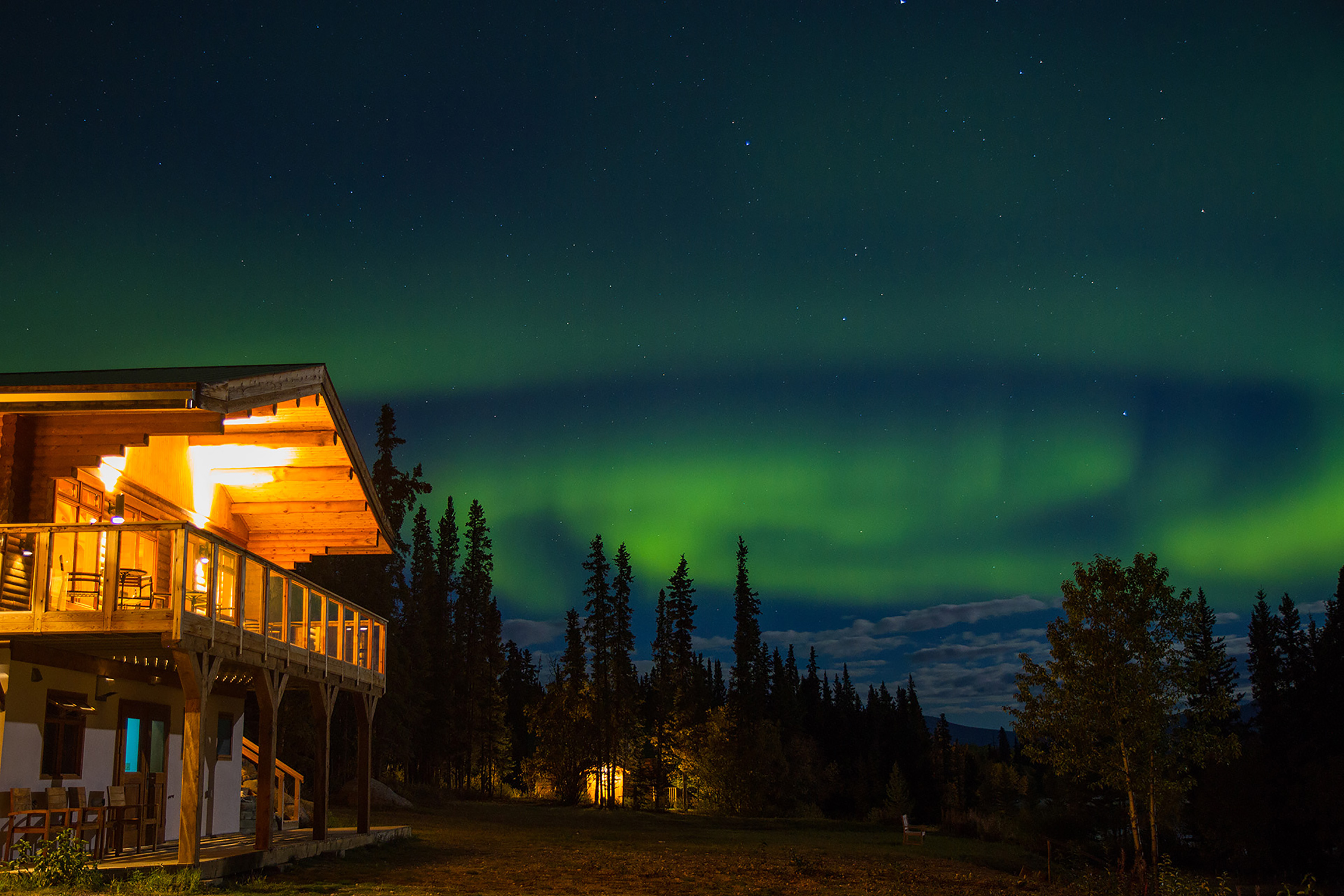 Southern Lakes Resort from the groun with the Northern Lights behind