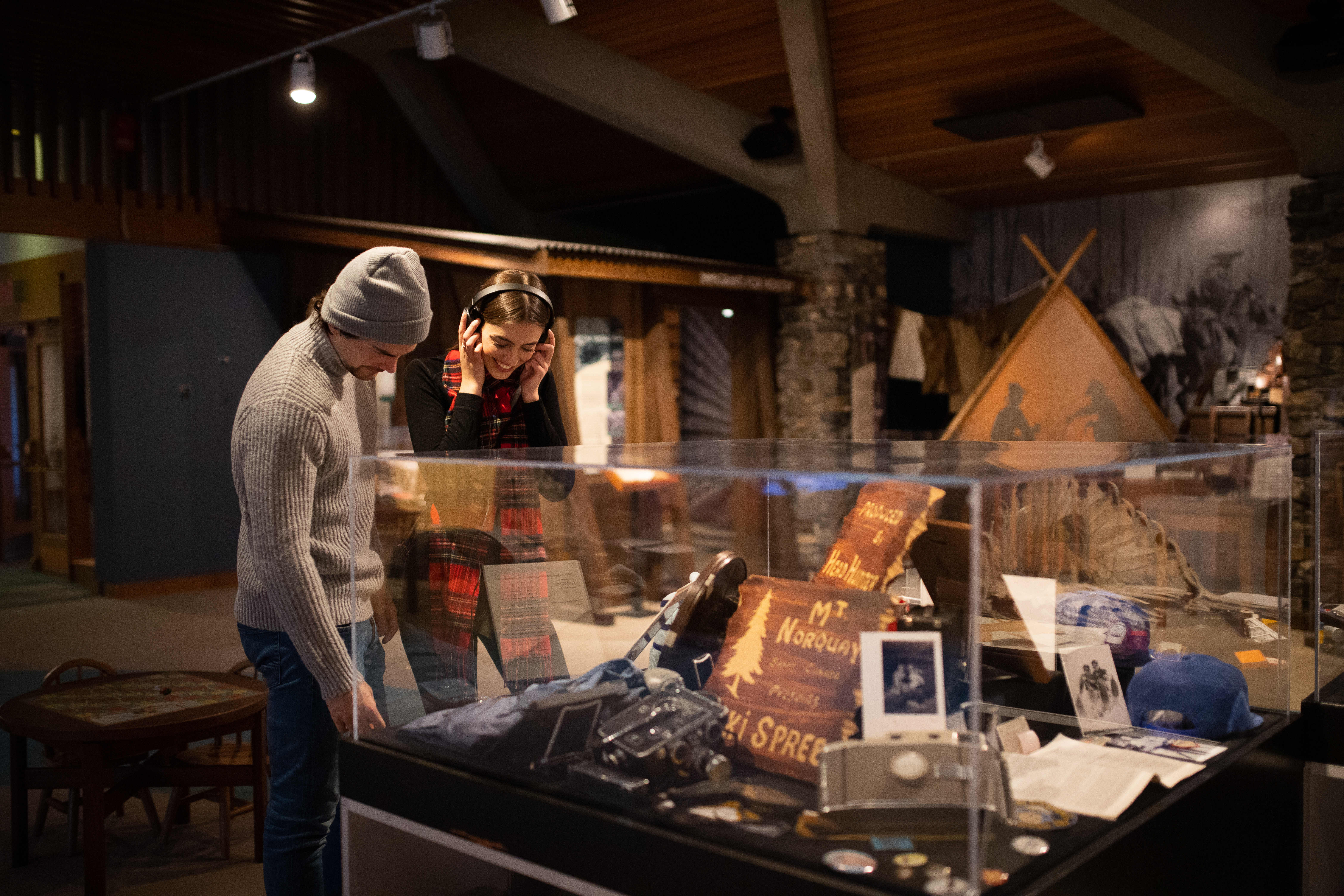 Two people look at a display of artifacts at the Whyte Museum in Banff