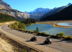 Two motorcycles driving through Jasper National Park on the Icefields Parkway