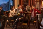 Couples dining on fondue at the Walliser Stube at the Fairmont Chateau Lake Louise