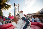 Man rides mechanical bull at Calgary Stampede