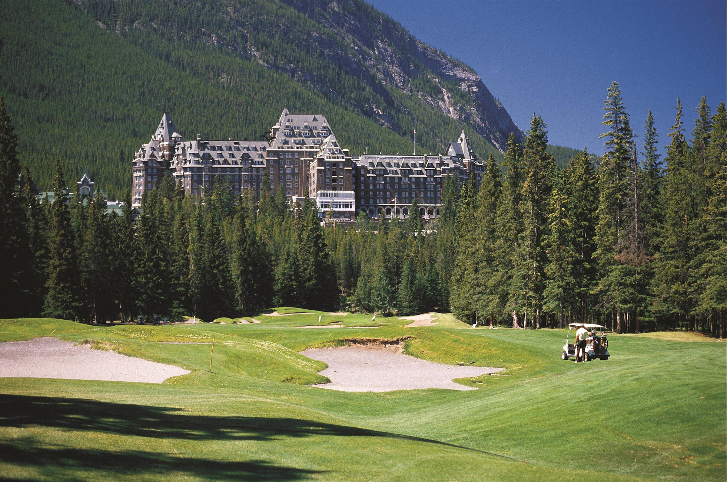 The view from hole 14, with the facade of the Banff Springs in the background, at the Fairmont Banff Springs Golf Course