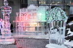Three ice sculptures of a man, a popcorn box and a cinema