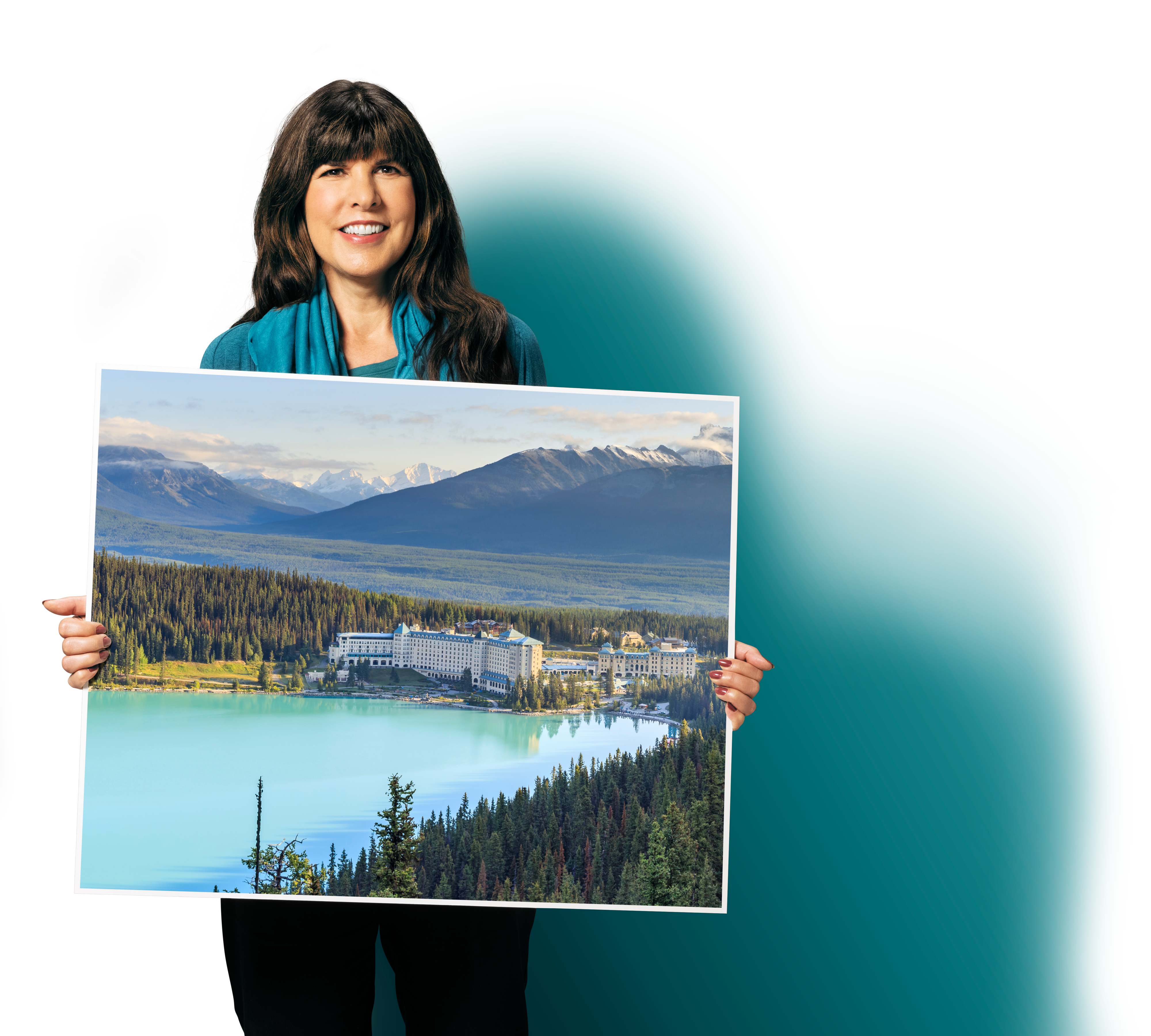 A person holding a large sign board with Canadian scenery on it