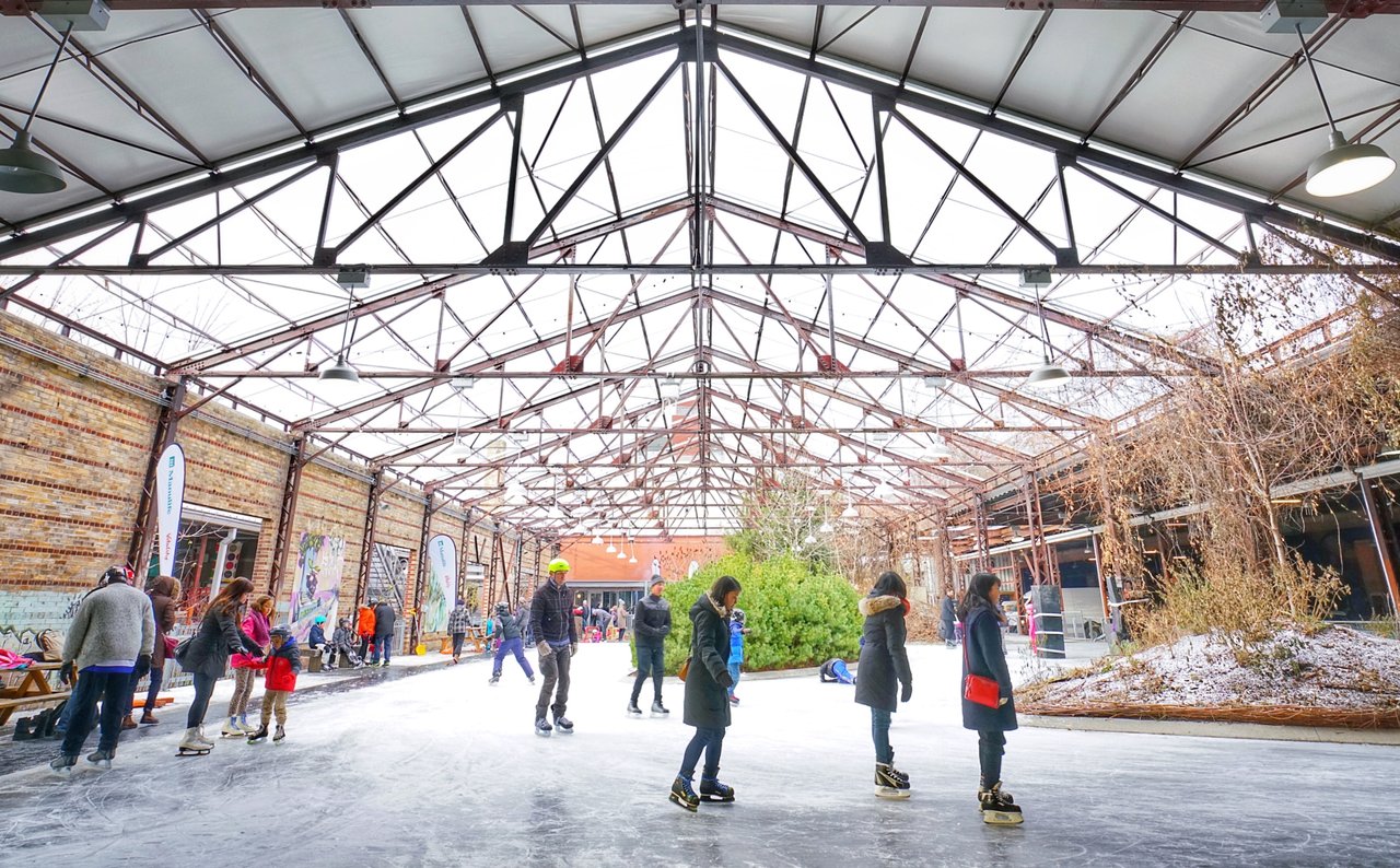 People skate on the public rink at Evergreen Brick Works