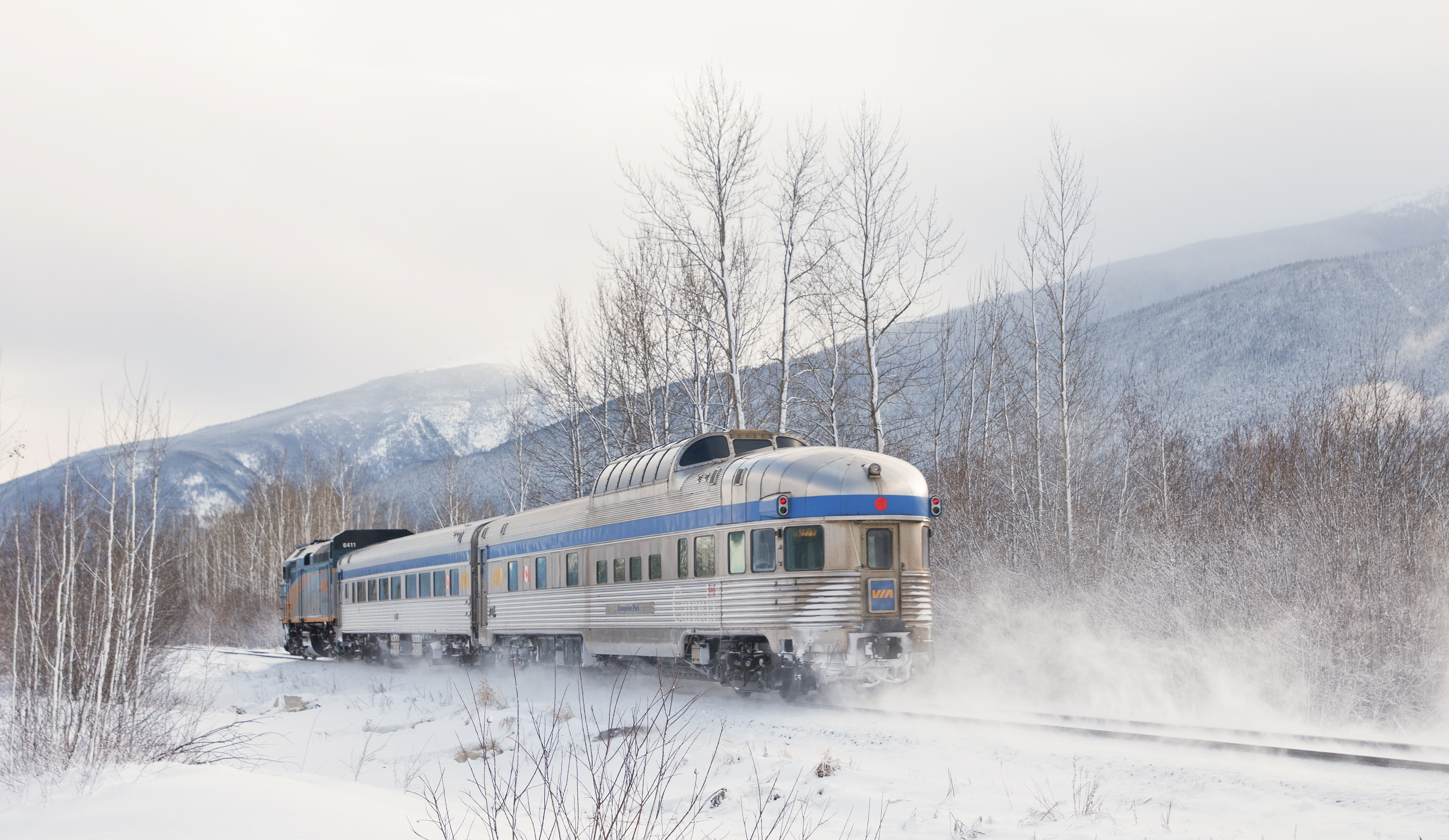 VIA Rail Skeena train between Jasper and Prince Rupert traveling through Winter landscape.