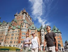 Family walking through Quebec City in the summer time