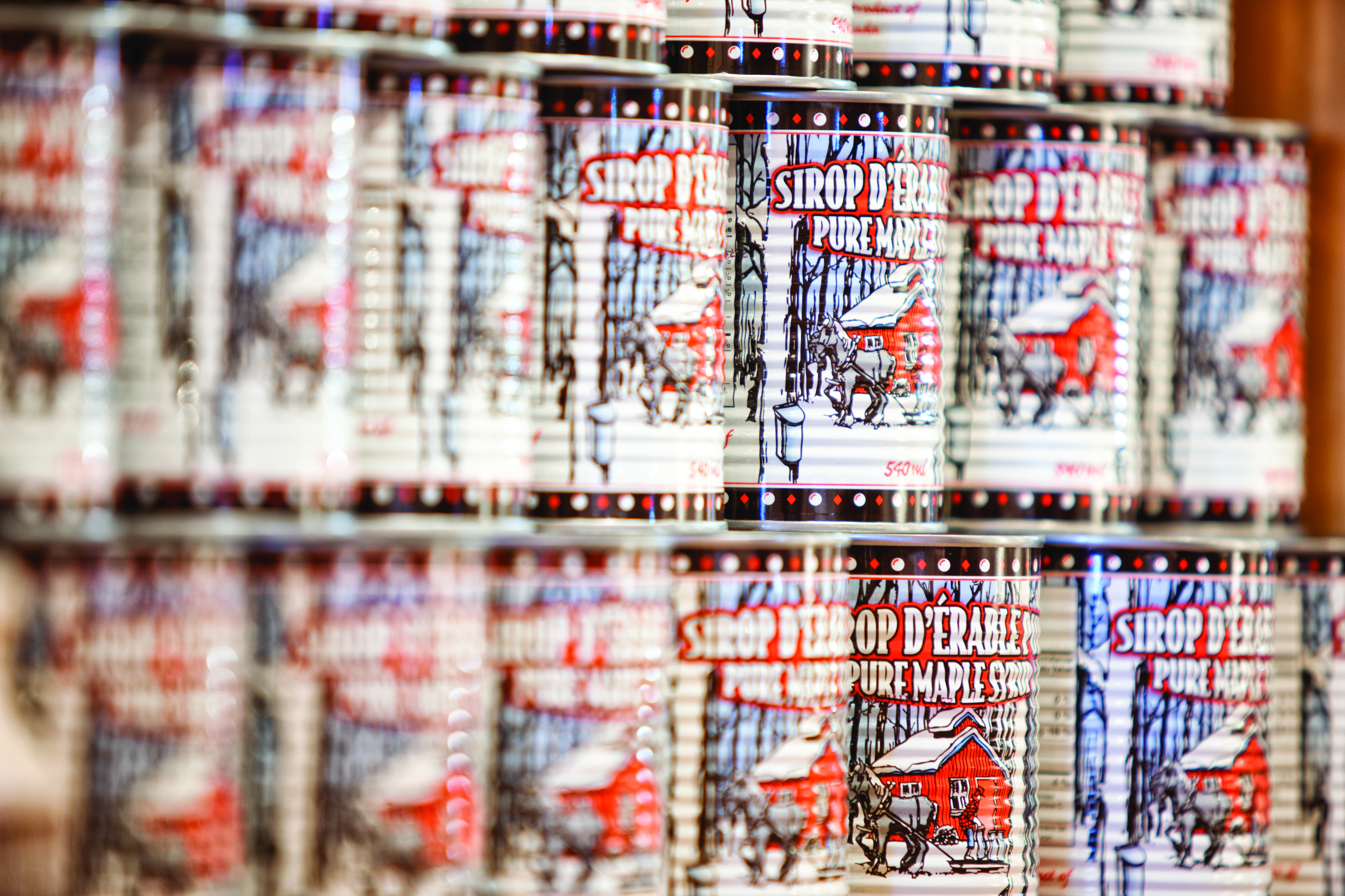 Stacks of cans of Canadian maple syrup 