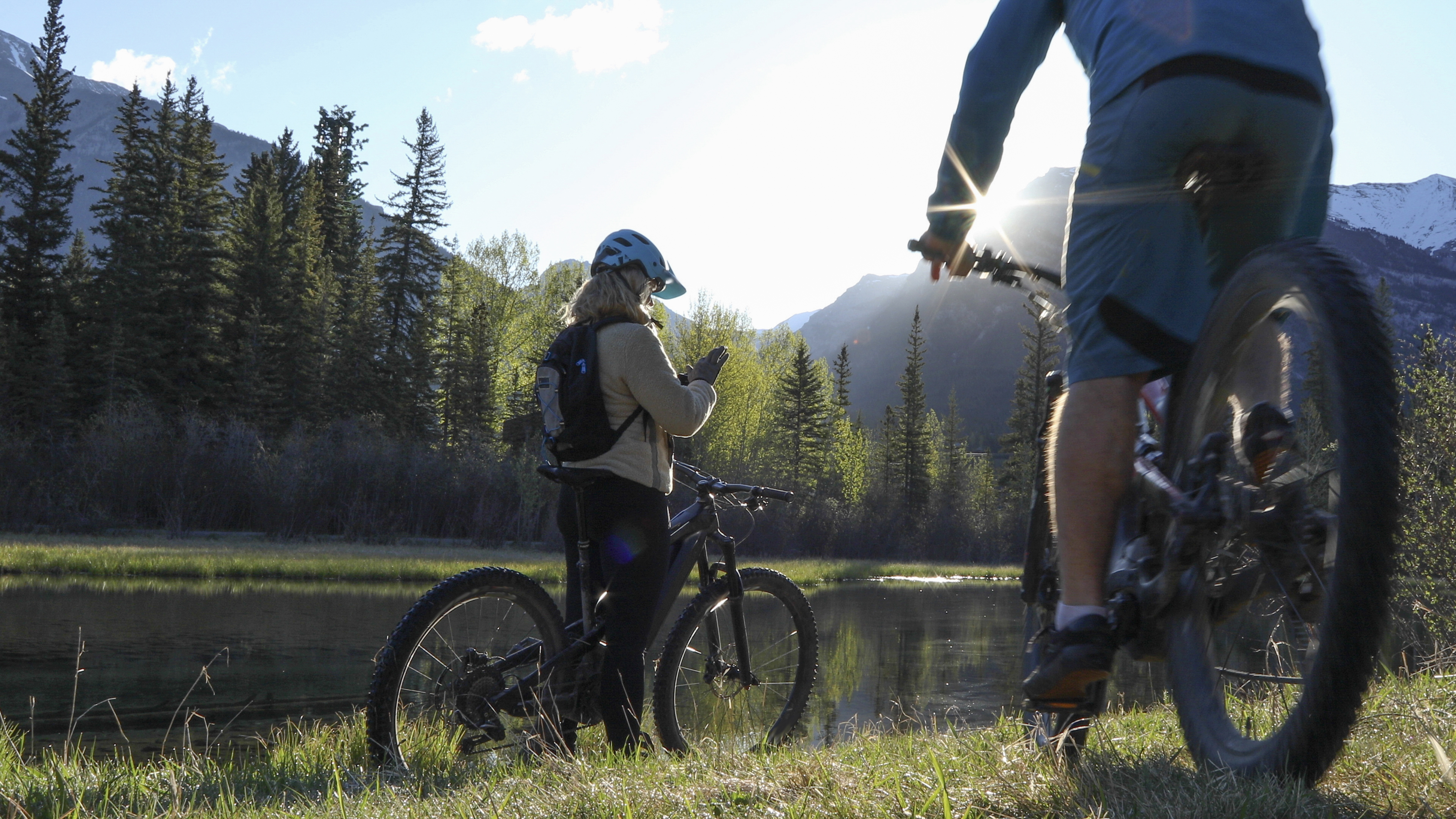 A couple bikes along a riverside trail in the Canadian Rockies