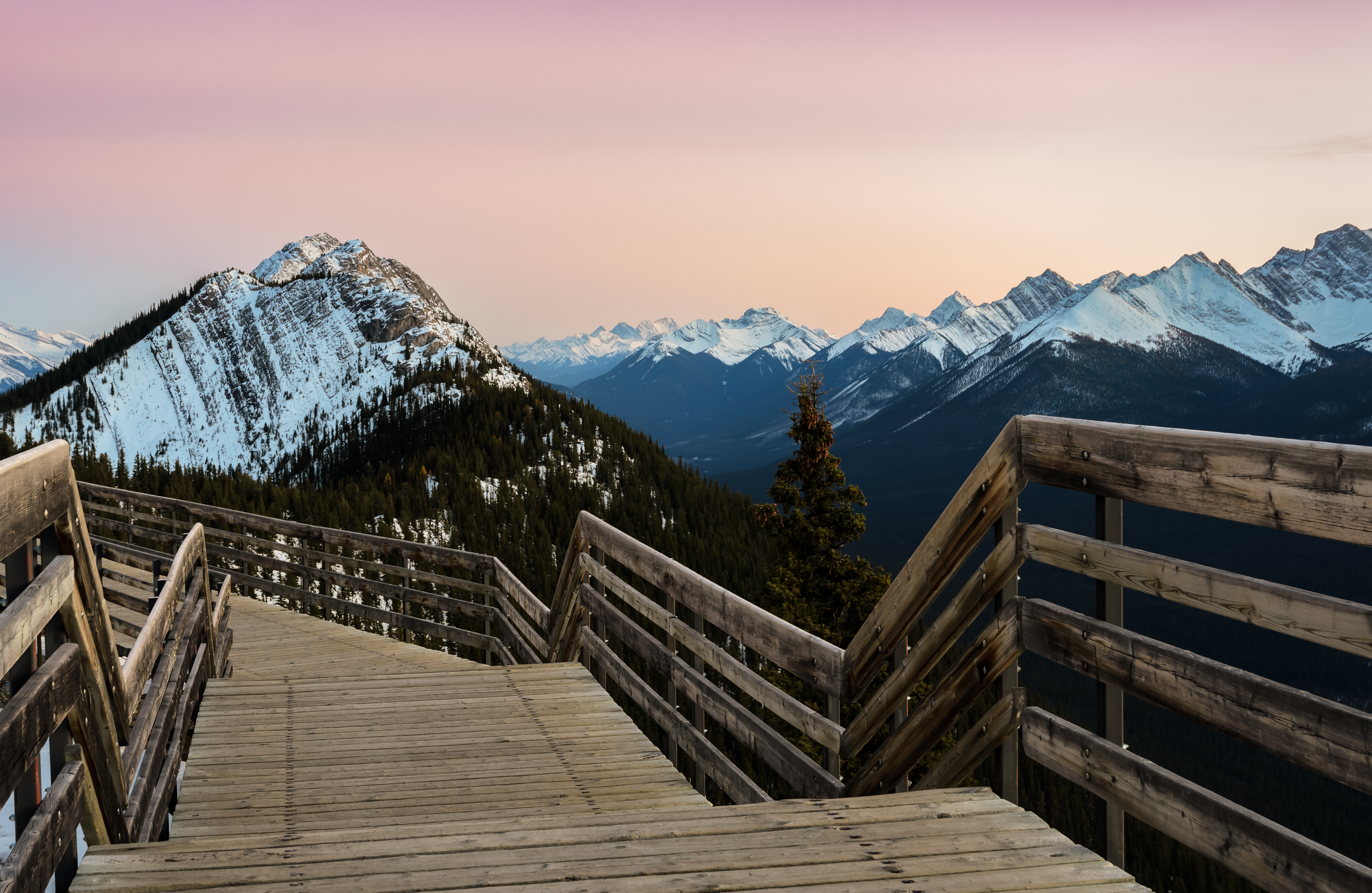 Stunning rocky mountains twilight scene of boardwalk on Sulphur Mountain connect to Gondola landing in Banff. Gondola ride to Sulphur Mountain overlooks the Bow Valley and the town of Banff.