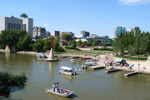View of boats on the river by the Forks National Historic Site in Winnipeg