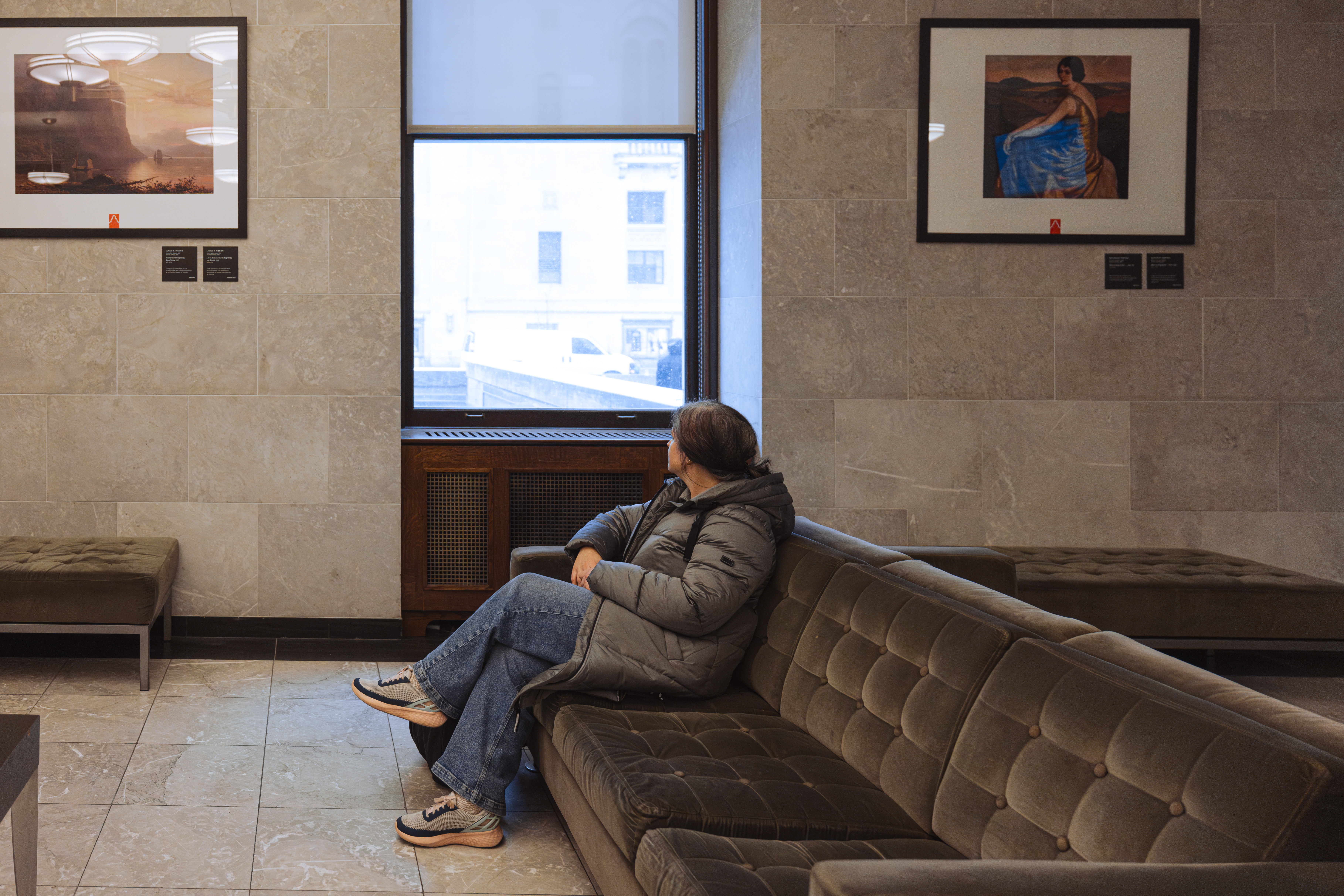 Mature woman sitting in Toronto Union Station's VIA Rail Business Lounge