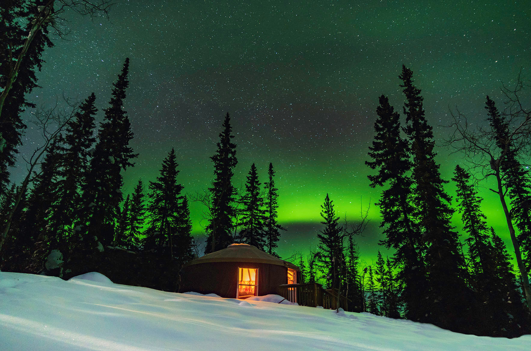 Aurora viewing hut in snow in Dawson City