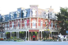 Prince of Wales Hotel with horse and carriage and tree-lined streets