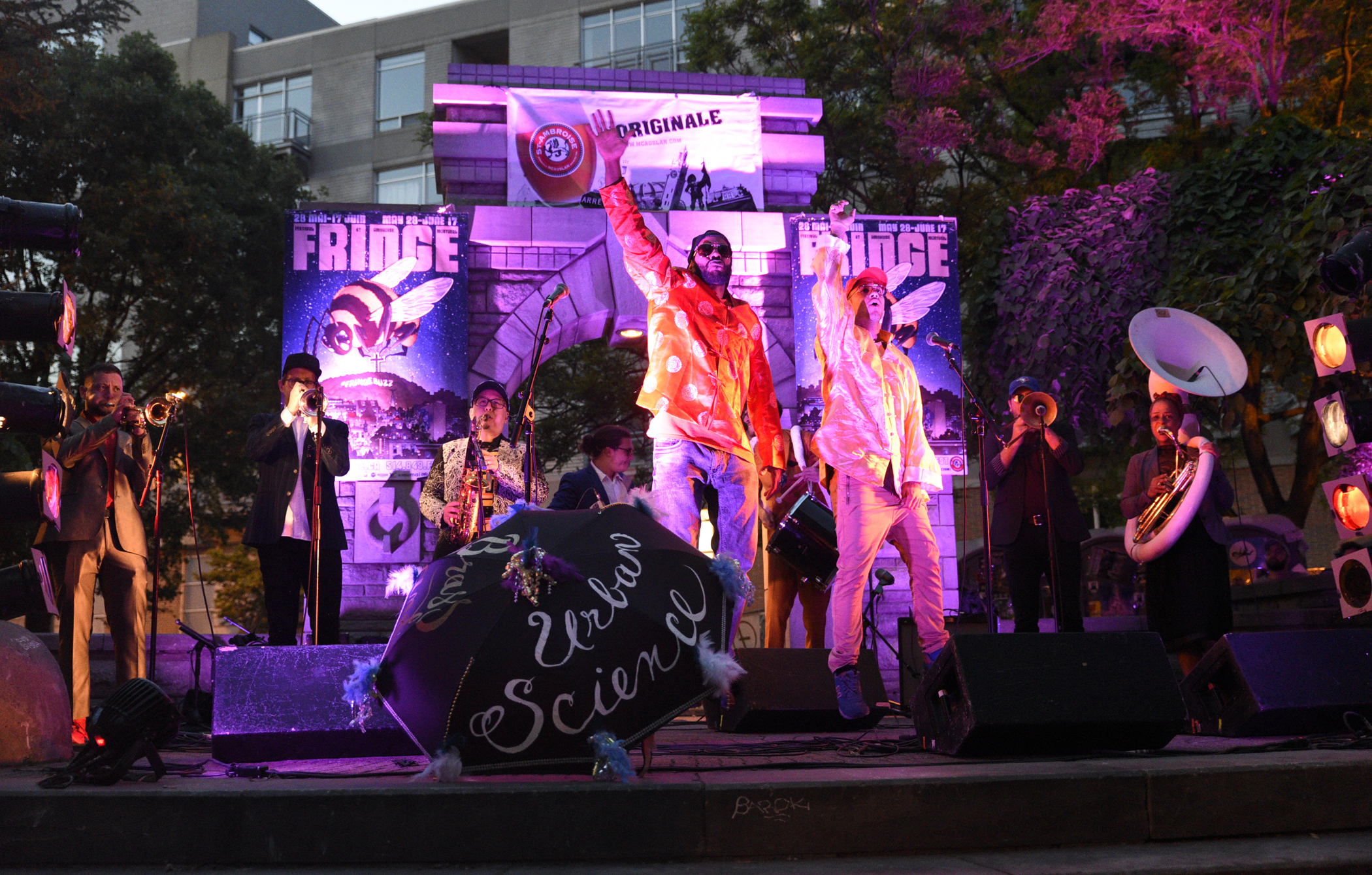 Performers on a small outdoor stage during the evening at the St-Ambroise Montreal Fringe Festival
