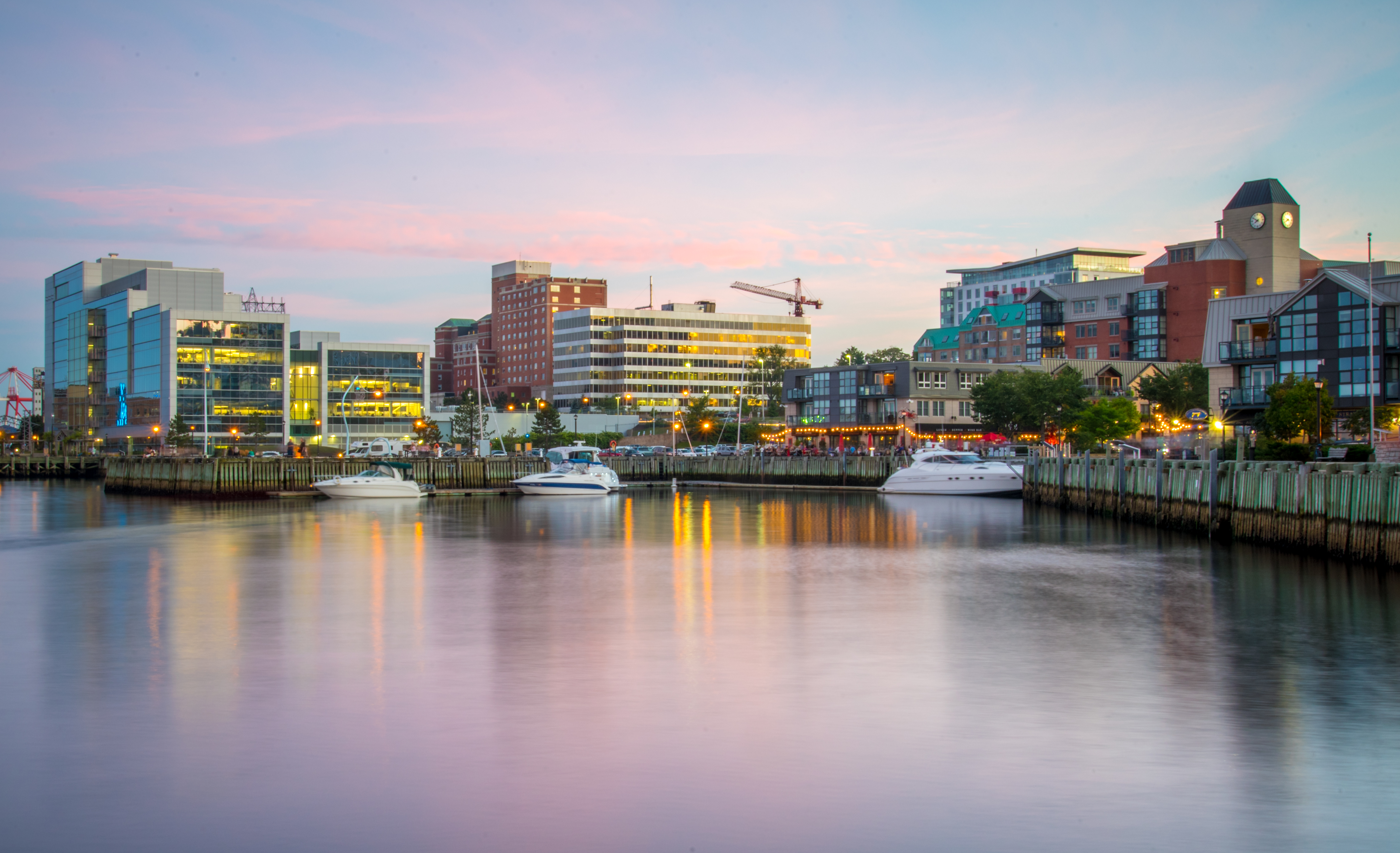 Sunset and pink clouds over the waterfront boardwalk in Halifax