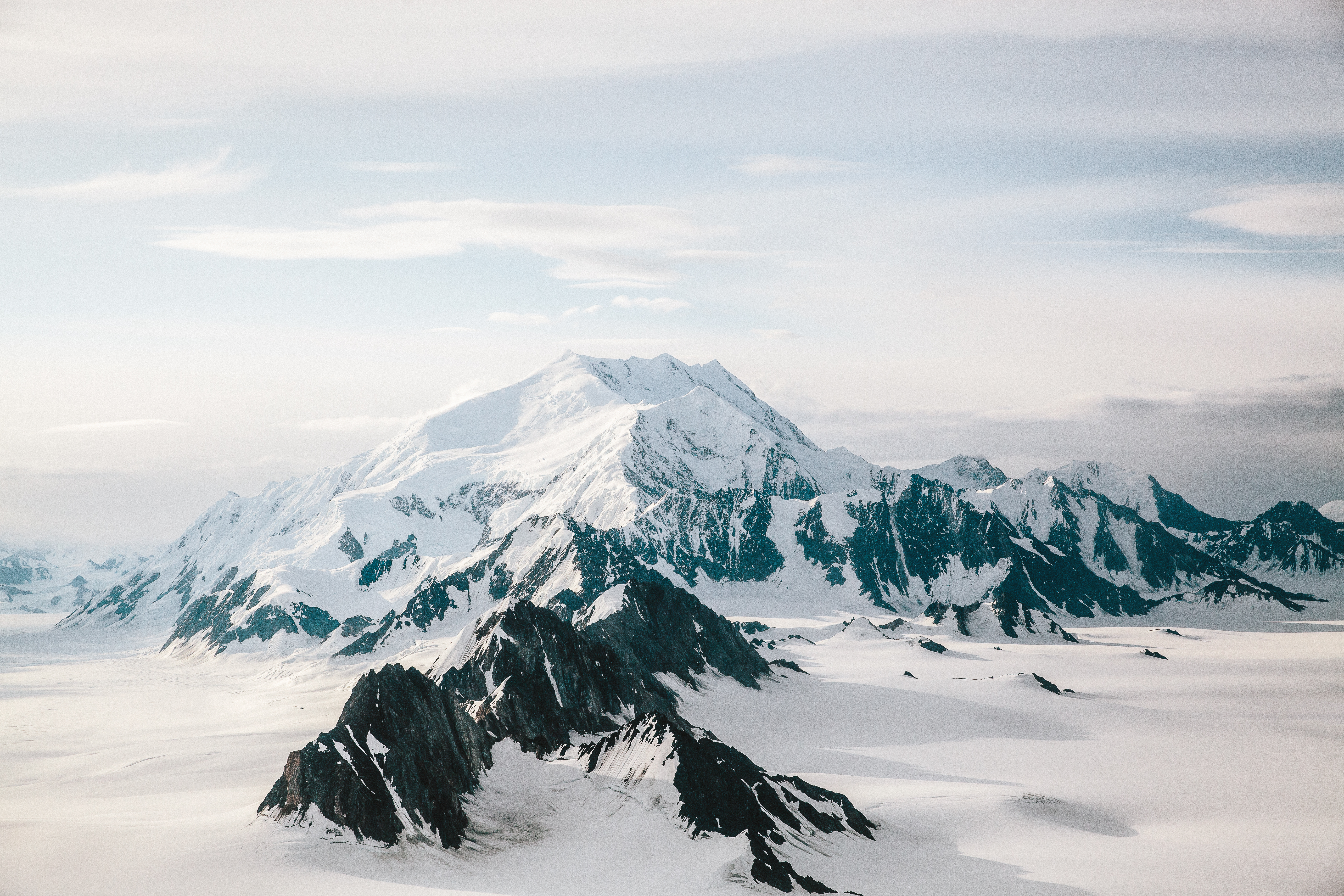 Jagged snow-capped mountain peaks in the Yukon