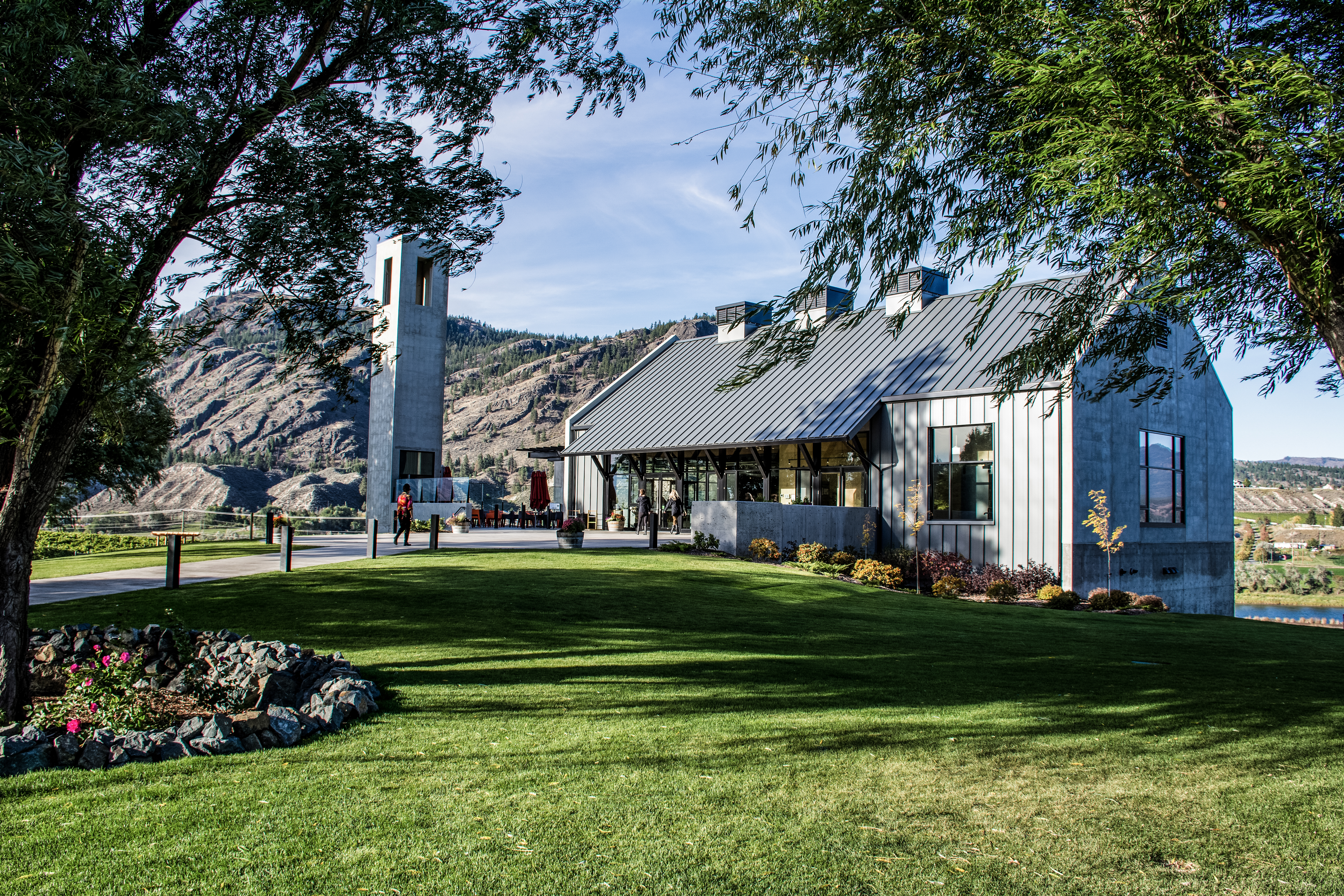 Pathway and green grass in front of the main building at Monte Creek Ranch Winery