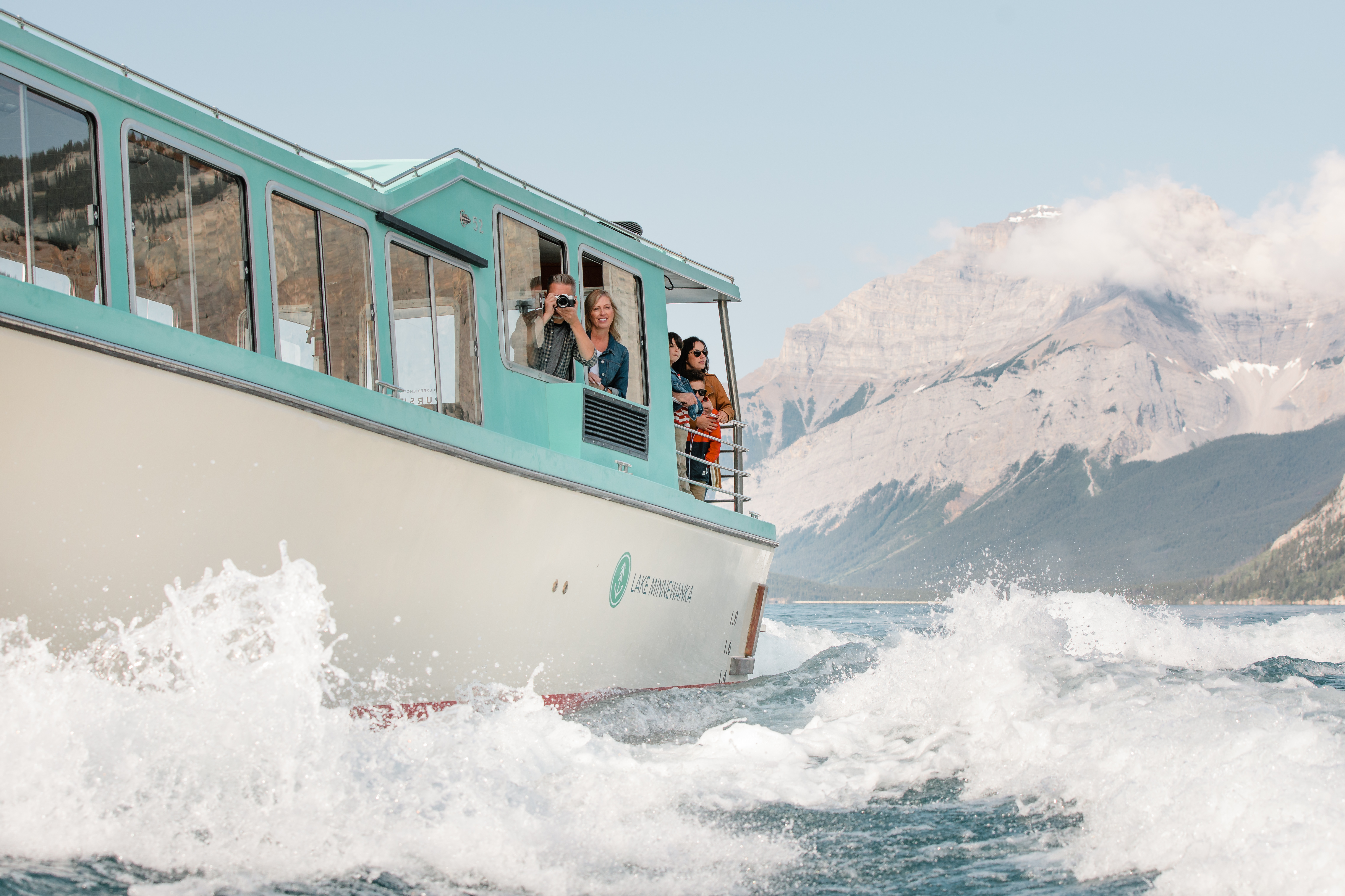 Waves crash against the cruise boat on Lake Minnewanka.