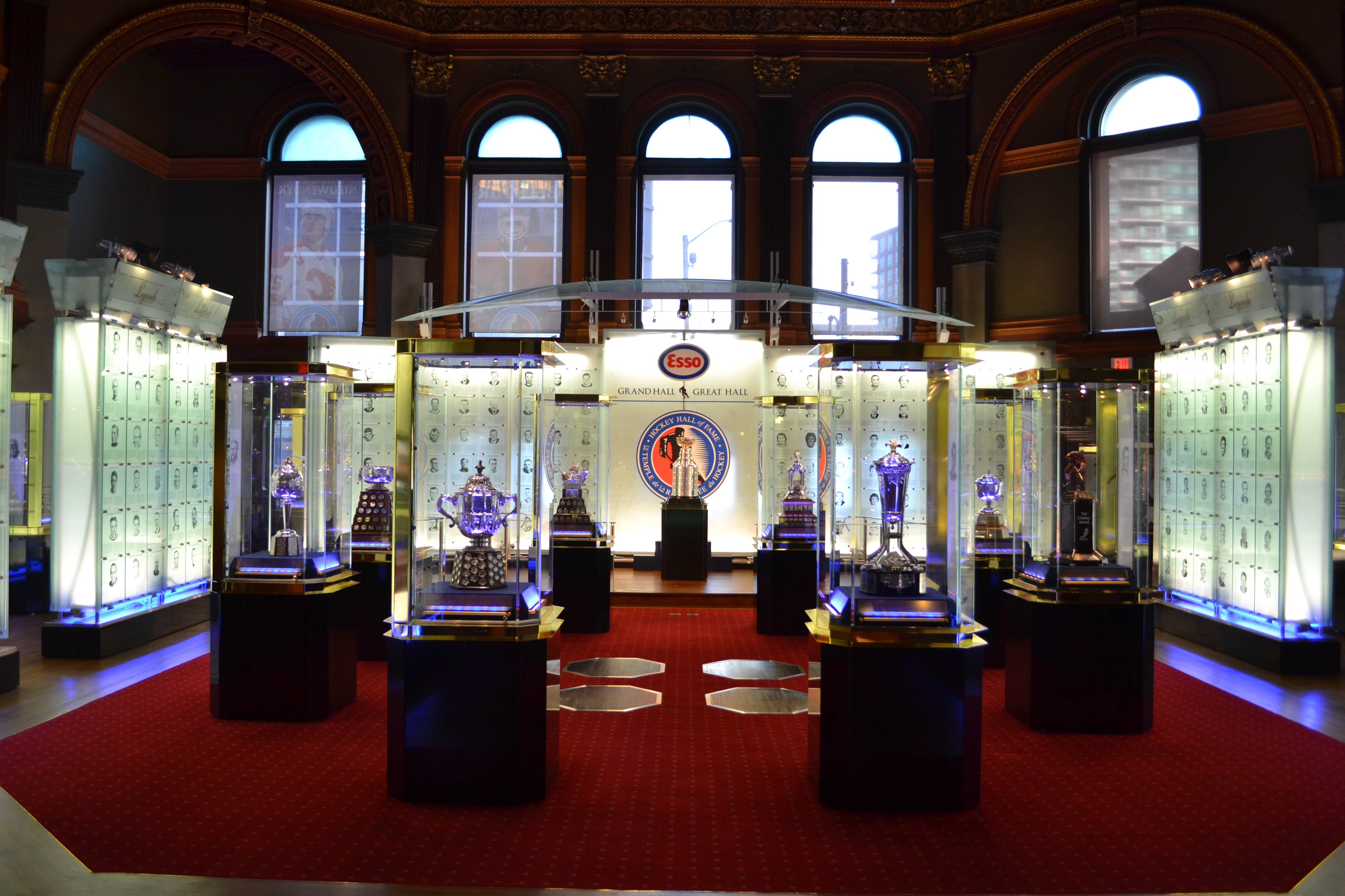 Hockey trophies on display in glass containers in a museum 