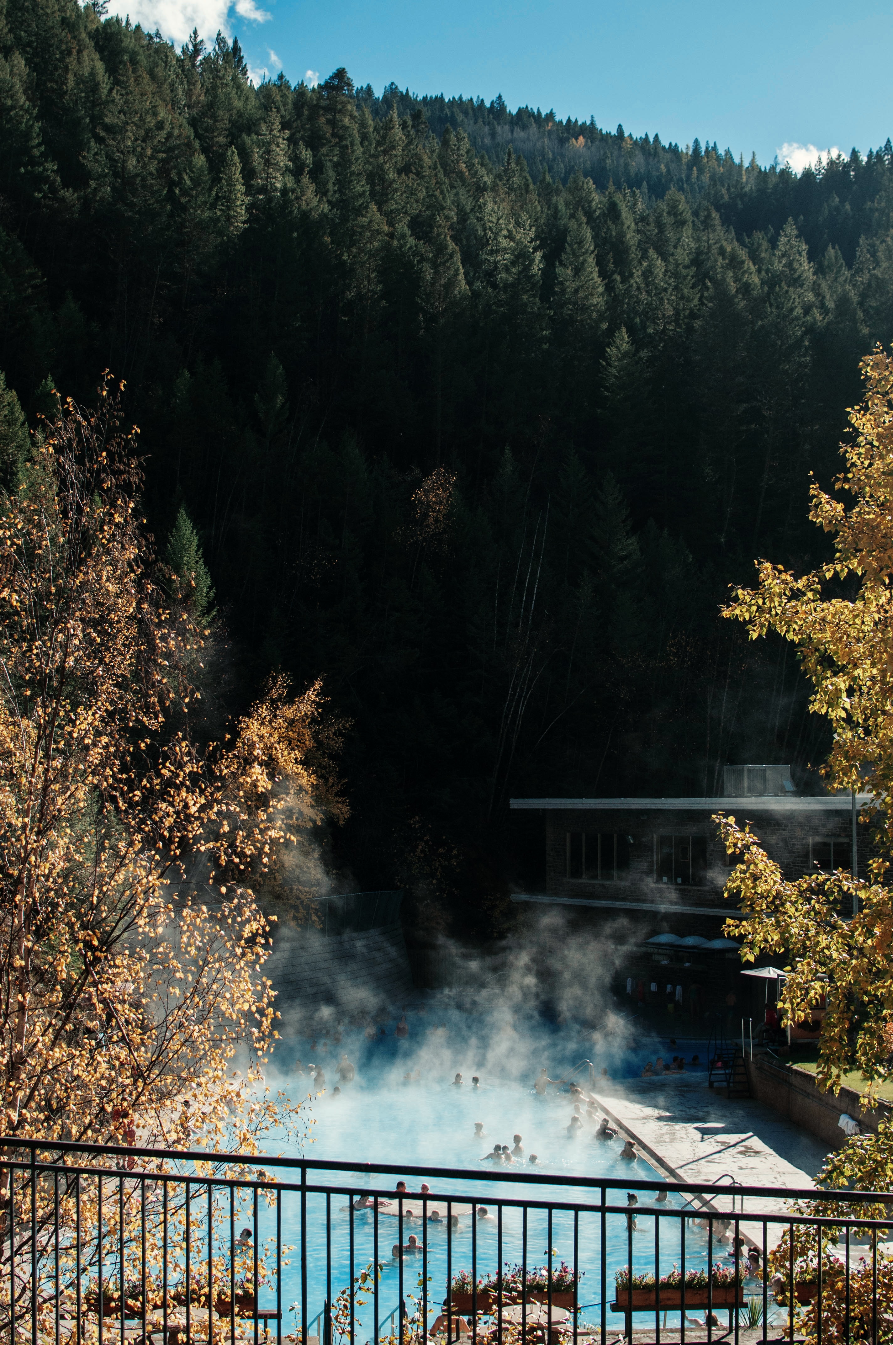 People soak in natural hot springs mineral pool in Kootenay National Park