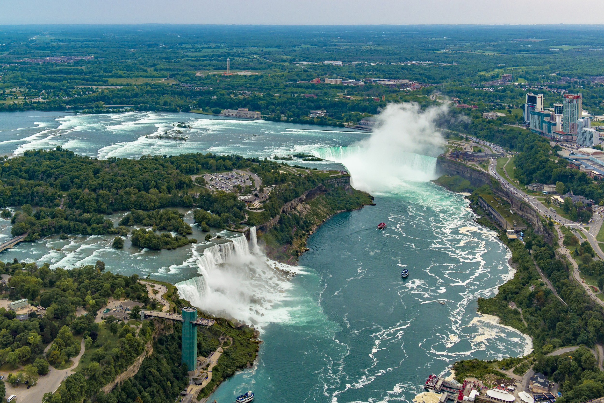 An aerial view above Niagara Falls including the American Falls and Horseshoe Falls