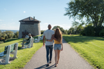 A couple walking along a pathway in the Plains of Abraham park in Quebec City