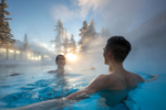 A couple in Banff Upper Hot Springs pool during winter