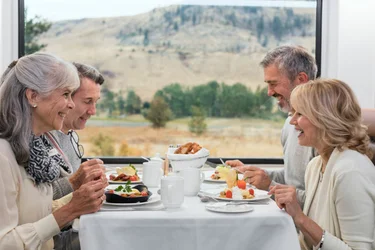 woman looking out window of Rocky Mountaineer train