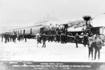 Men next to C.P.R. locomotive 371 at the Port Moody railway station.