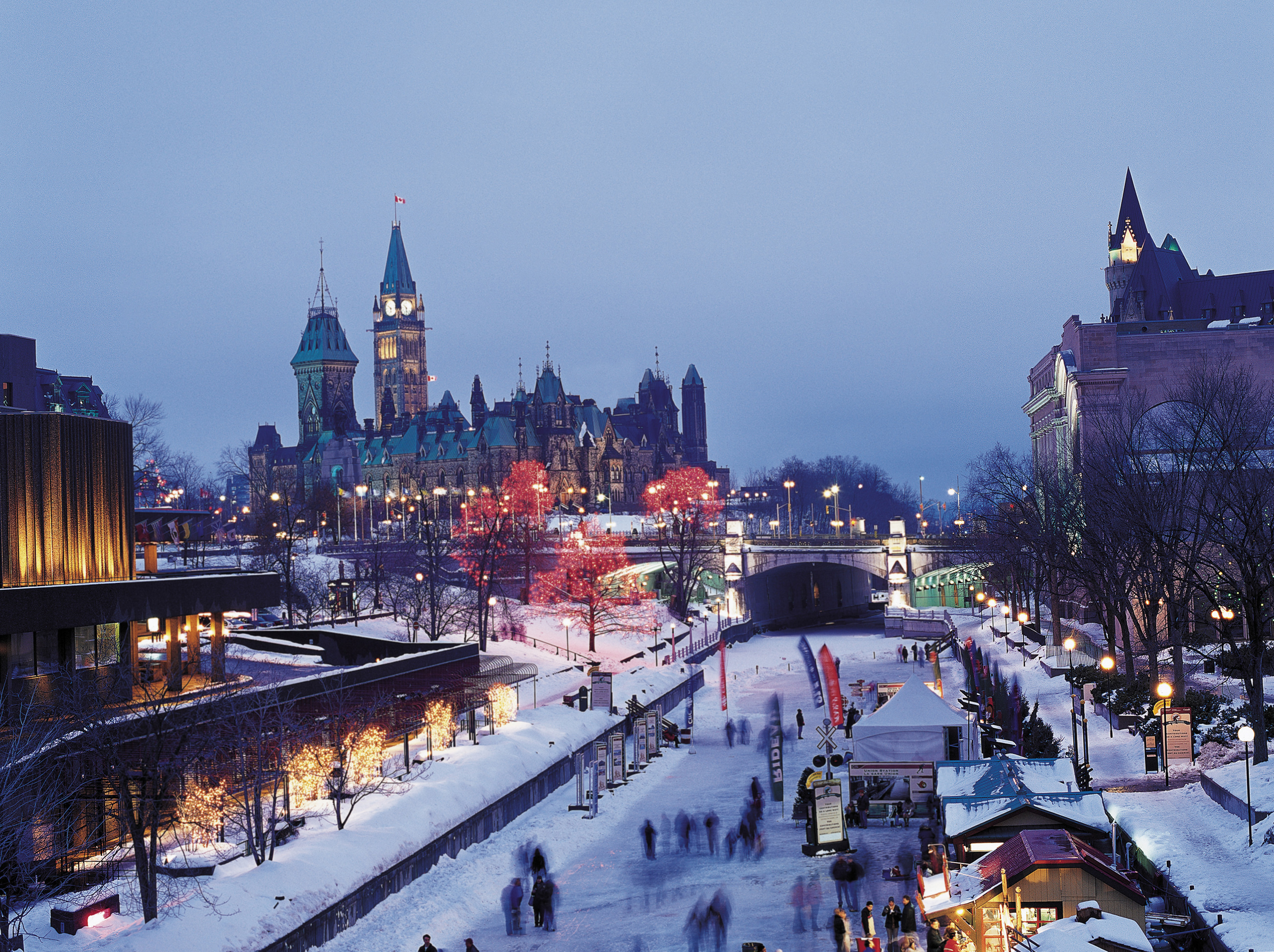 Evening view of people skating on the Rideau Canal in Ottawa