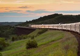 Train with dome cars crosses the Prairies