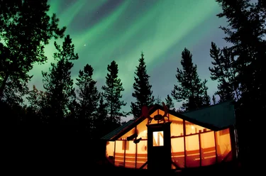 Northern lights over a cabin