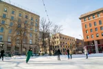 People ice skating in Old Market Square in Winnipeg's Exchange District