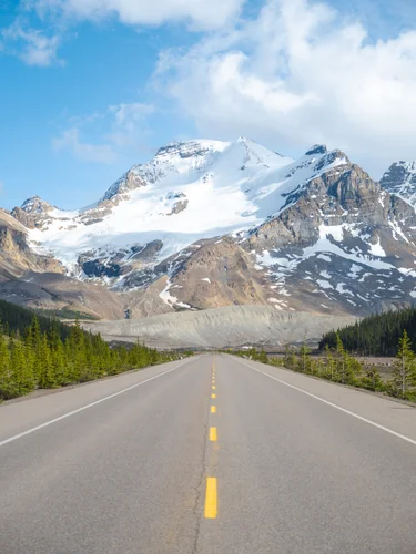 View of road with mountain and glacier in front