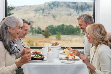 Couples enjoying breakfast in GoldLeaf dining room on the Rocky Mountaineer Vancouver to Banff Train