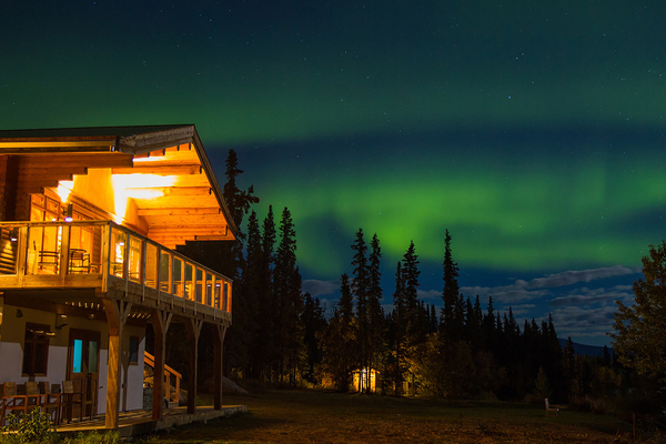 Southern Lakes Resort from the groun with the Northern Lights behind