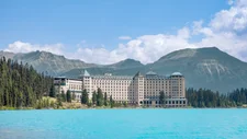 Landscape view of the Fairmont Chateau near Lake Louise with the mountains and forest in the background