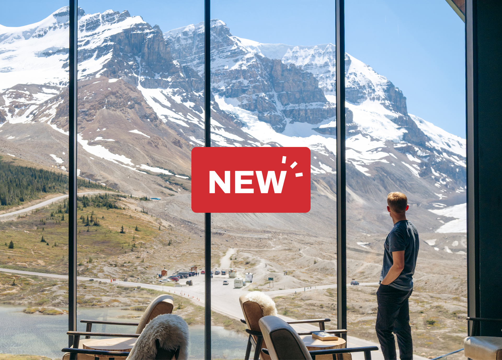 A man looks through the window at Glacier View Lodge.