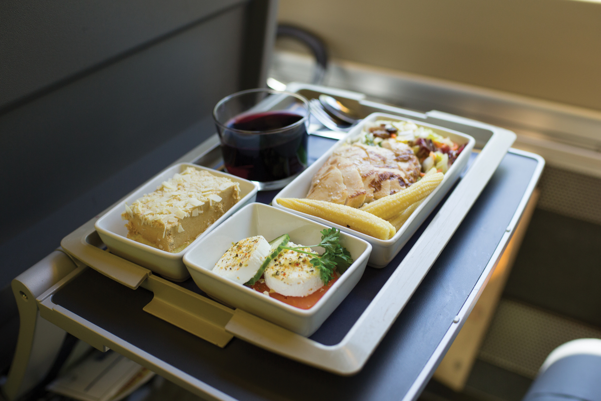 Meal on a tray table in Business Class on the Corridor train