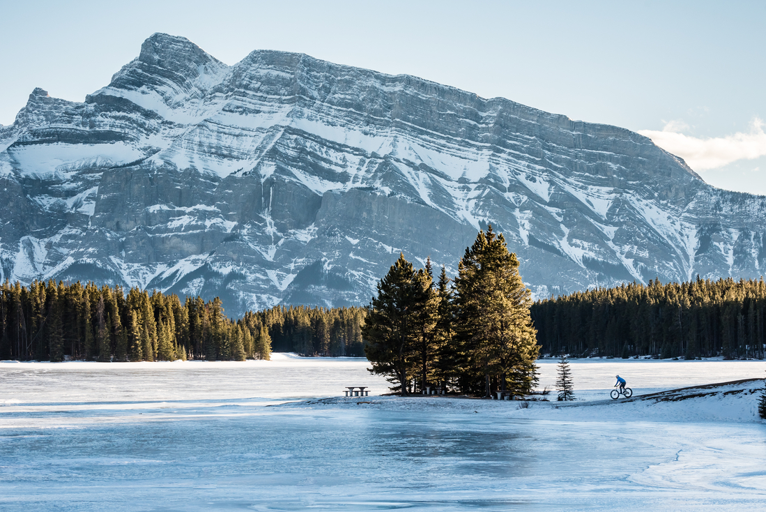 Shot of Two Jack Lake in the Canadian Rockies during winter, a place that people can experience when traveling to the Rockies by train.