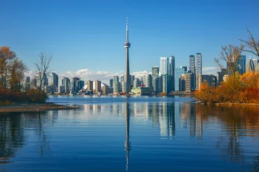 Landmarks of Toronto with the CN Tower, white stadium dome of the Rogers Centre, and the skyscrapers of the downtown business district.